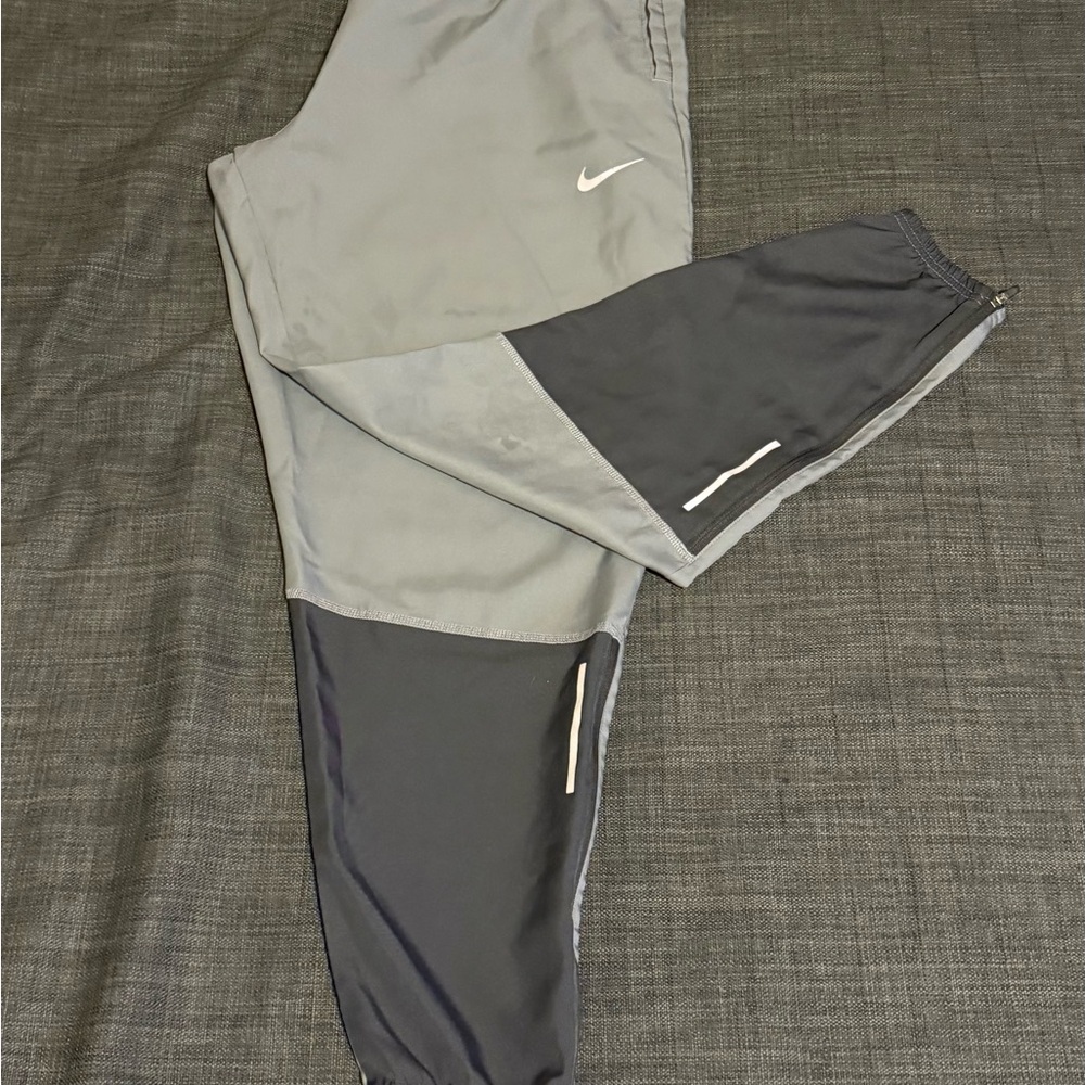 Nike Gray and Black Sweatpants with Elastic Waistband and Tapered Leg Openings